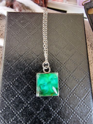Sterling silver square pendant on sterling silver snake chain, pendant contains green and gold art