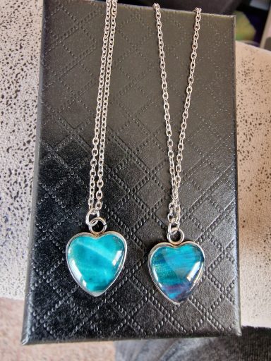 Two sterling silver heart pendant on sterling linksnake chain, pendant contains muted purple and turquoise artwork