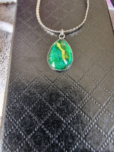 Sterling silver teardrop pendant on sterling silver flat chain, pendant contains green and gold art