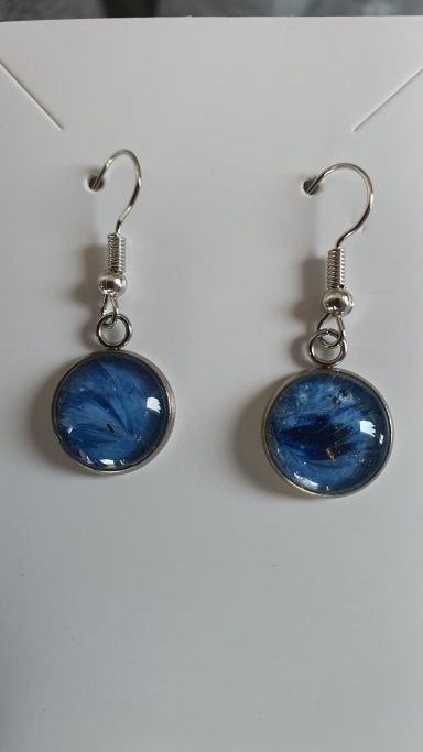 Silver colour round drop earrings containing original dark blue art work